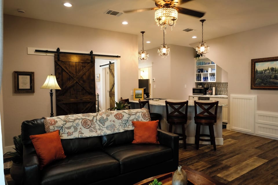 Cozy living space with rustic barn doors and stylish breakfast bar