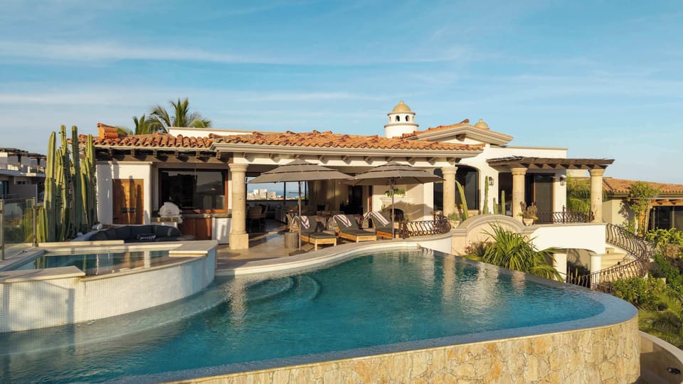 Soak in the sun by the infinity pool and jacuzzi, with plenty of lounging space and a bar ready for afternoon drinks.