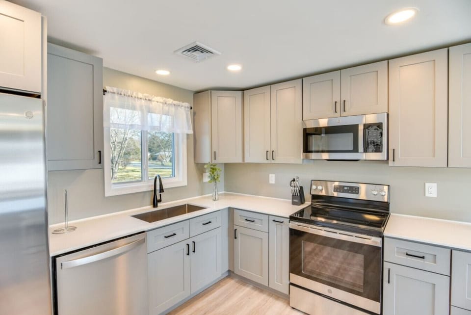 Kitchen | Stainless Steel Appliances | Corner Window & Cabinet Storage