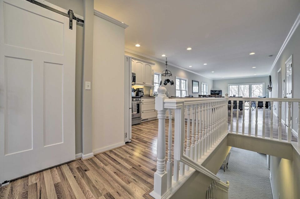 Stairwell | Wood Floors & White Railings