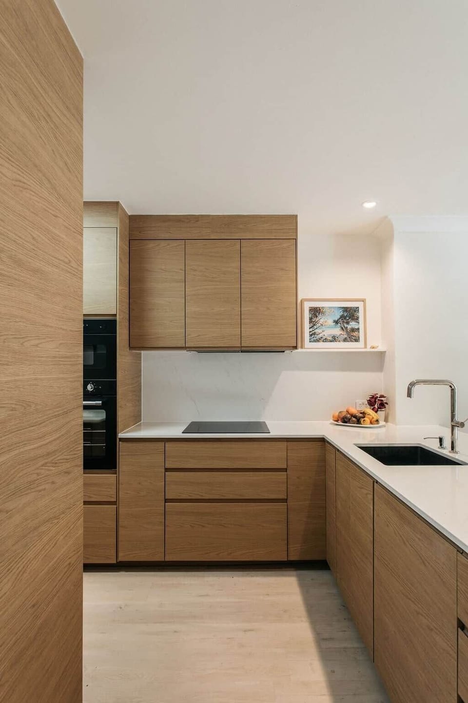 Fabulous oak styled kitchen with art and paneled appliances. Quiet luxury.