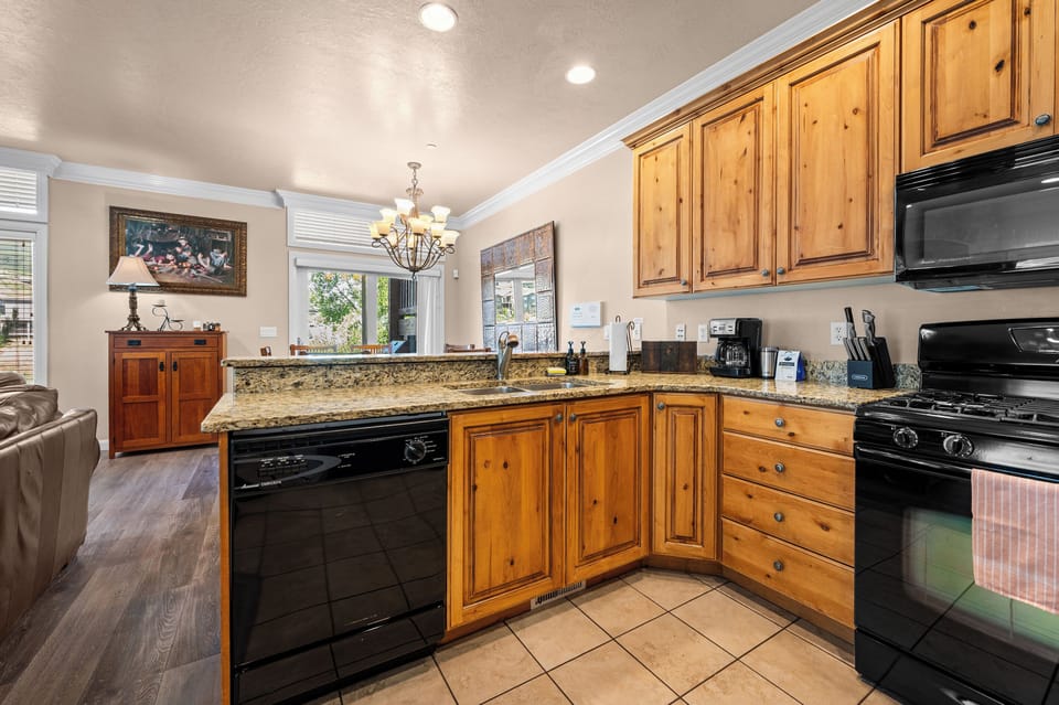 Open kitchen with generous counter space overlooking the dining and living areas.
