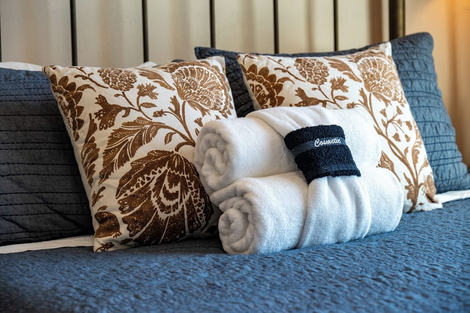 Thoughtful touches and plush linens help create a warm and welcoming stay.