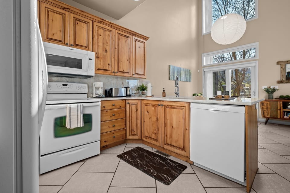 Fully equipped kitchen with generous counter space and everything needed for family meals or après-ski snacks.