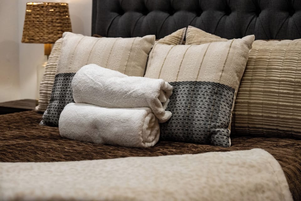 Soft linens and fresh towels are ready to welcome you after a day of adventure.