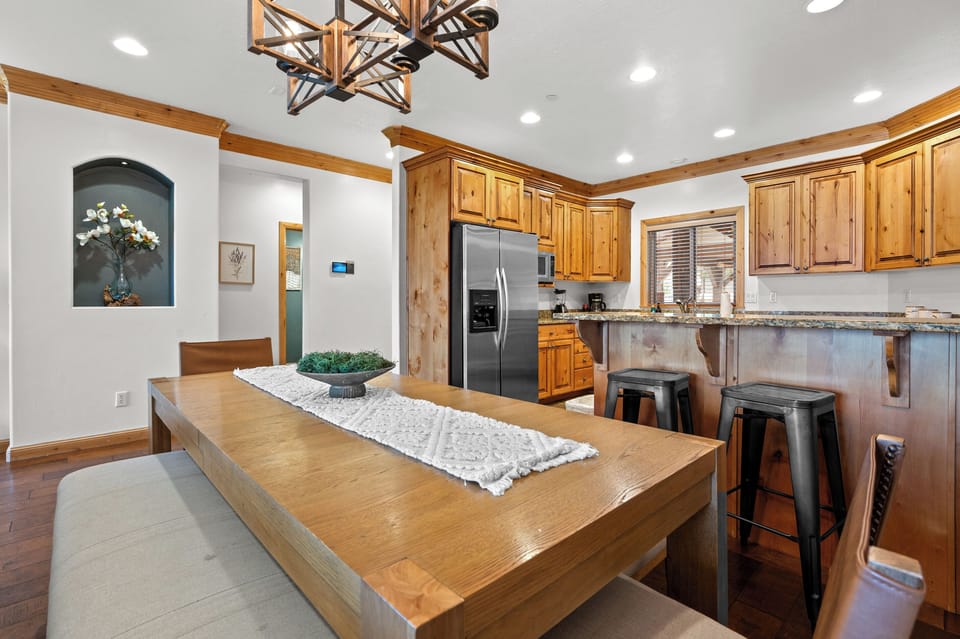Spacious dining area conveniently located beside the kitchen with plenty of seating for your group.
