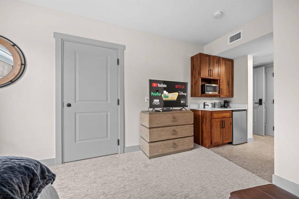 Unwind with your favorite shows on the smart TV in this thoughtfully designed space.