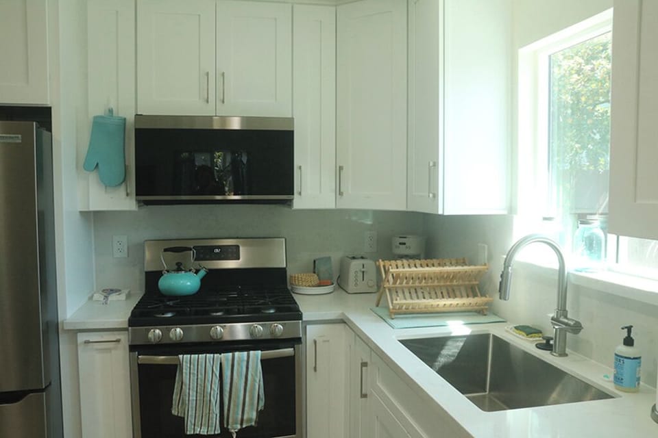 View of full kitchen, morning light