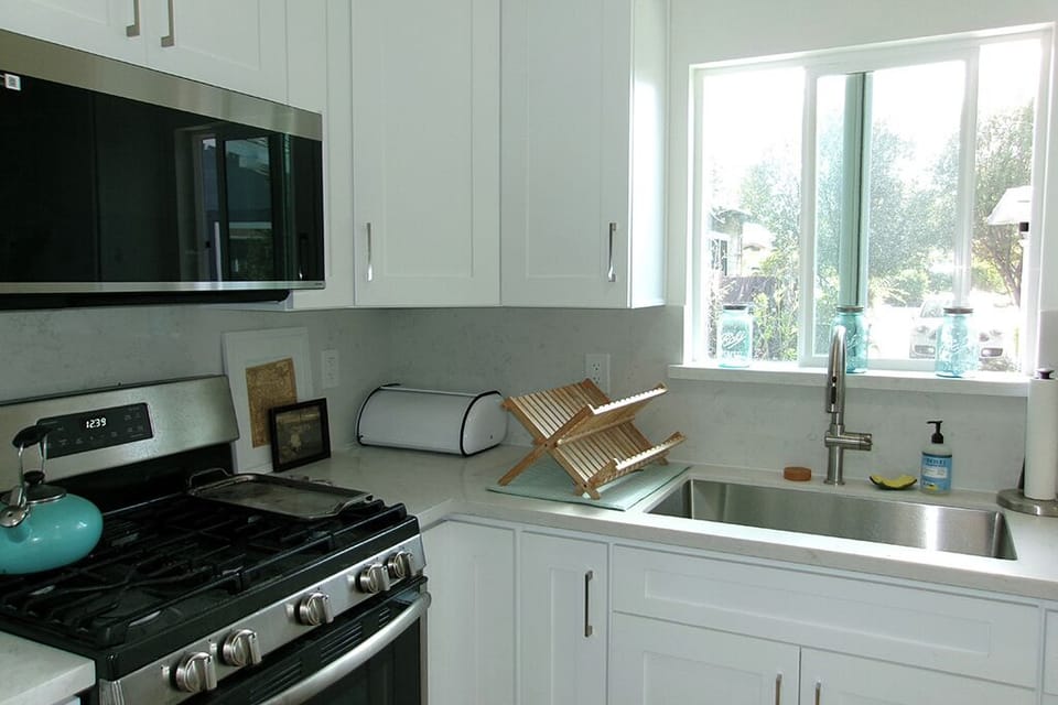 View of full kitchen, morning light