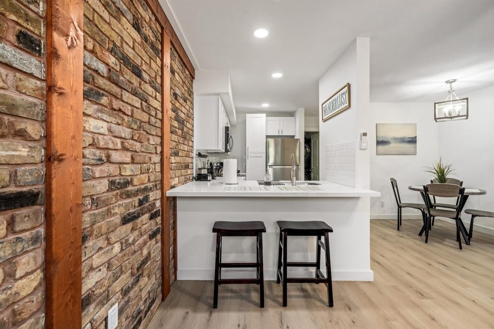 Peninsula seating for 2 in the kitchen provides a cozy spot for quick meals or conversation while cooking.