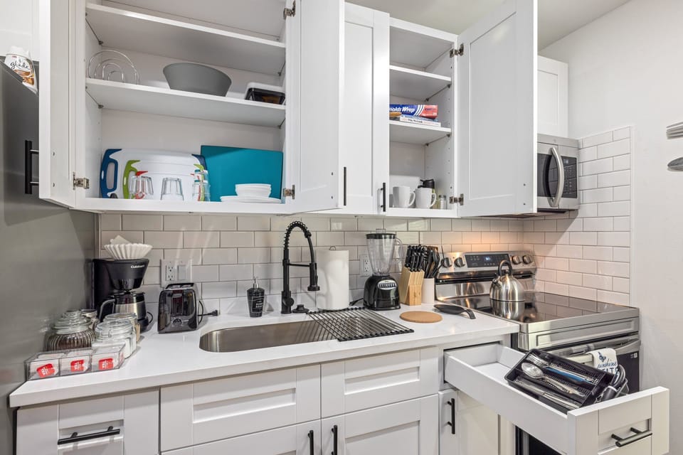 Your fully stocked kitchen includes coffee, sugar, cream, and tea, along with everything else you need to cook comfortably.