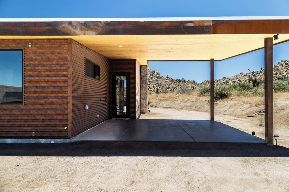 Modern desert retreat with covered patio and striking natural surroundings