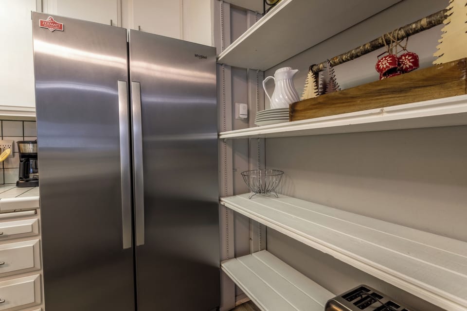 Kitchen "pantry" area has plenty of food storage space.