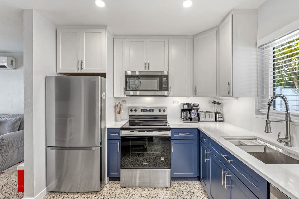 Functional kitchen layout with updated appliances and thoughtful storage.