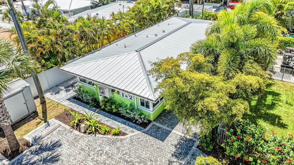 Aerial view of the layout surrounded by lush greenery.