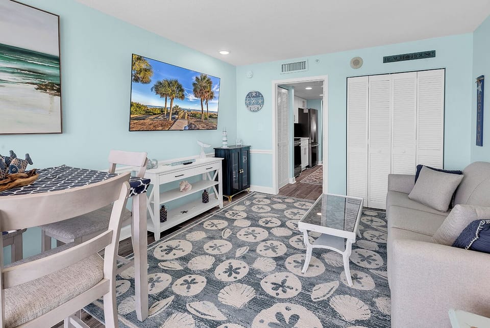 Beautiful oceanfront view from your penthouse suite! Comfortable living room with a 65" Roku TV, doubles as a second sleeping area with a pull out sofa sleeper! Also has a dining room table and chairs!