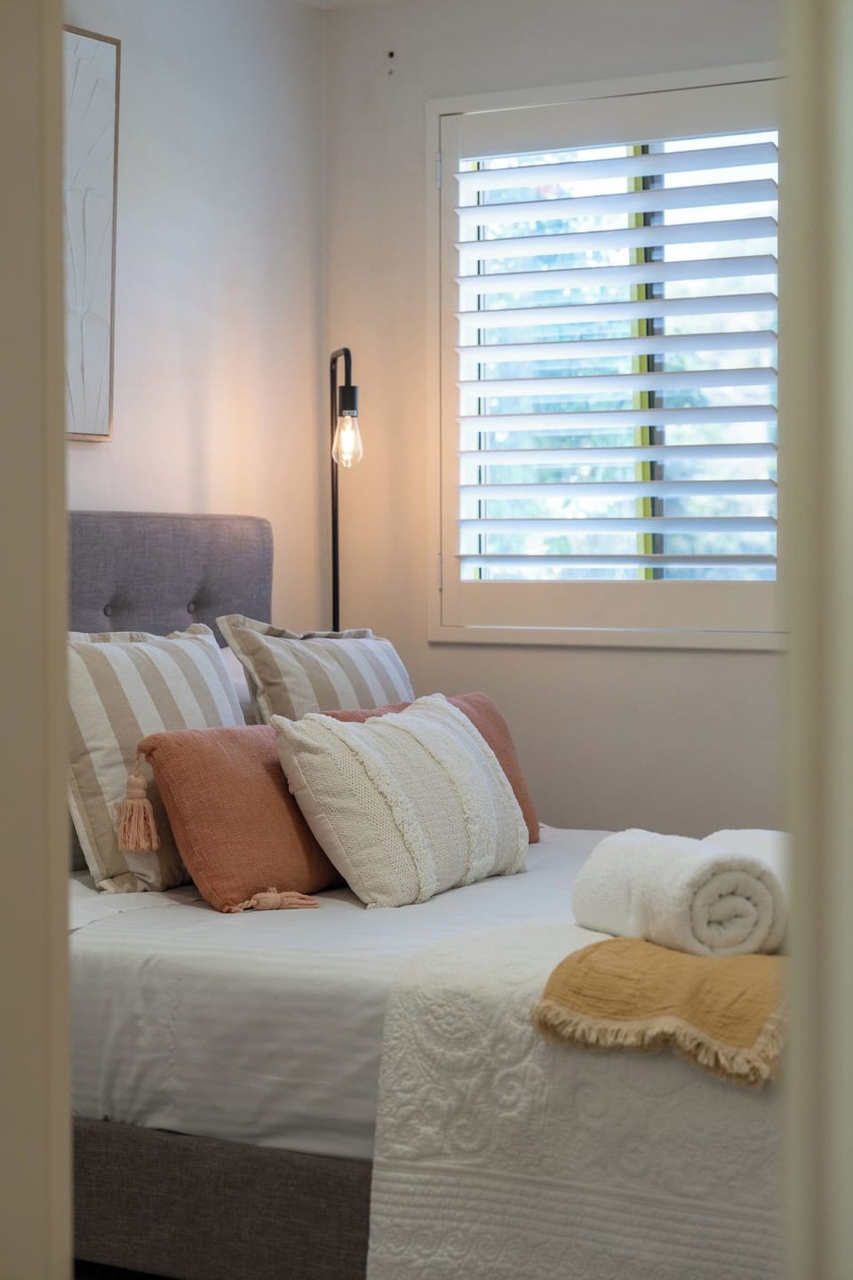 Softly layered master bedroom that feels calm the moment you step in.