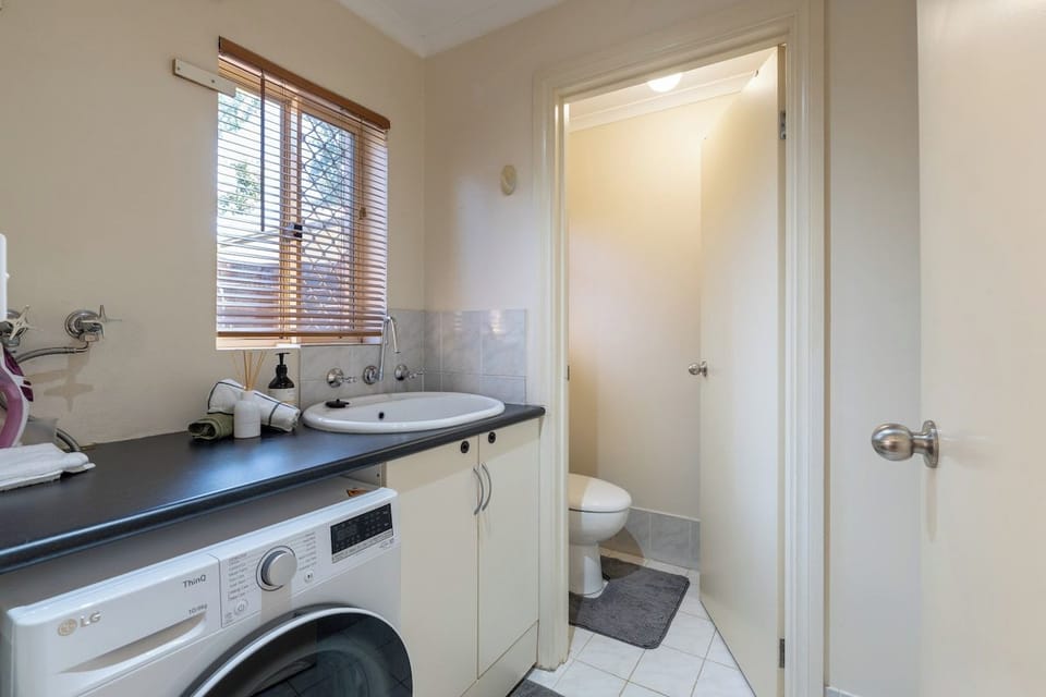 A combined laundry and utility zone that works quietly in the background.