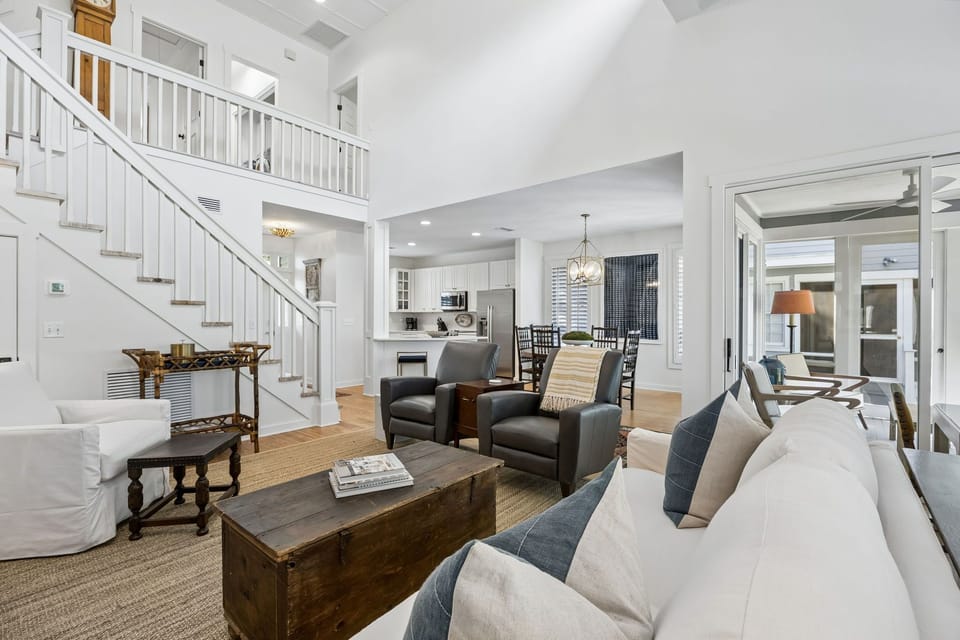 Luxury Living Area Featuring Plush Couch and Chairs, Flat Screen Smart TV, and Gorgeous Decor