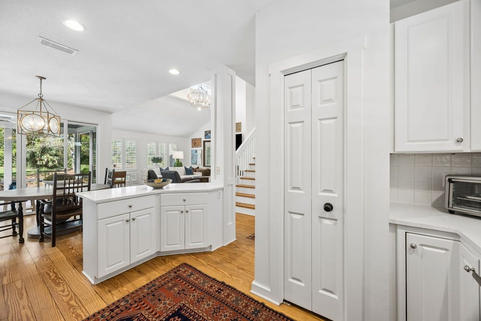 Updated Kitchen with Quartz Countertops, Stainless Steel Appliances, and Barstool Seating for 2