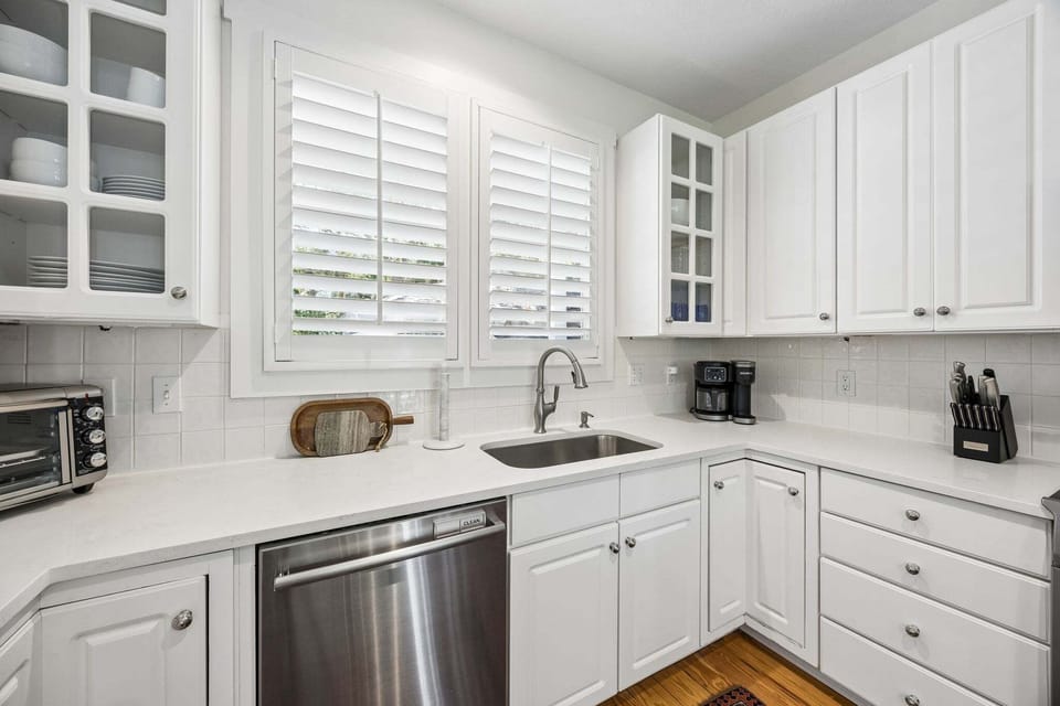 Updated Kitchen with Quartz Countertops, Stainless Steel Appliances, and Barstool Seating for 2