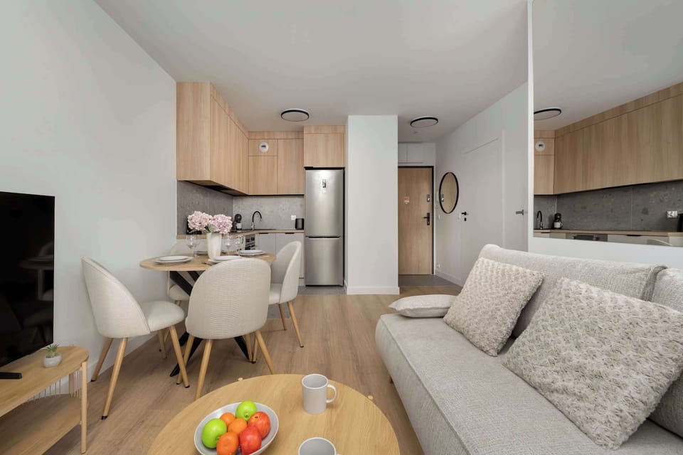 The living room has a modern look and comfortable furniture.