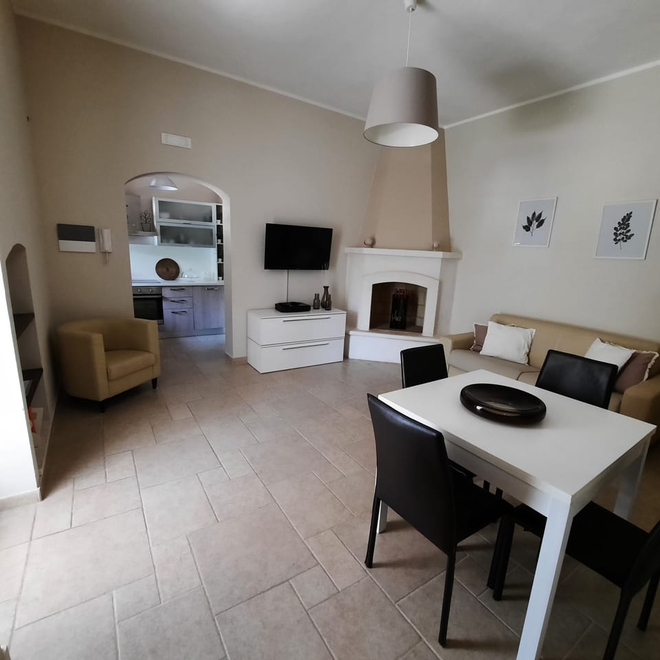 Comfort Condo, 1 Bedroom, Patio, Garden View | Living area | 55-inch flat-screen TV with satellite channels, TV, fireplace