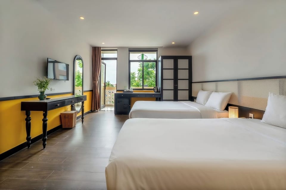 Deluxe Triple Room, City View | In-room safe, desk, laptop workspace, soundproofing