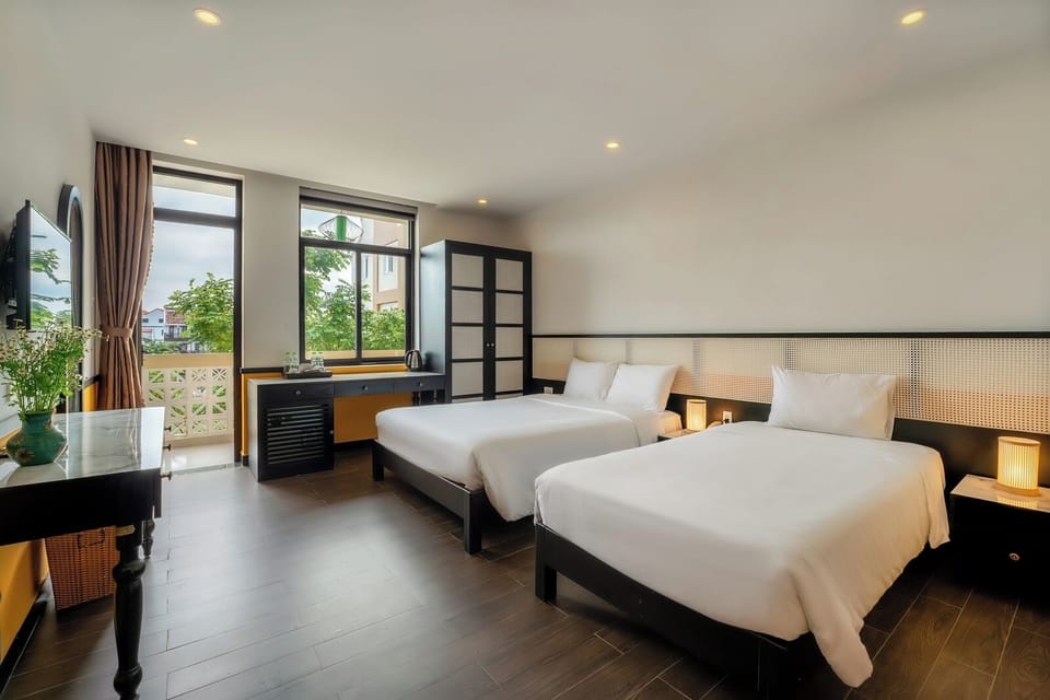 Deluxe Triple Room, City View | In-room safe, desk, laptop workspace, soundproofing