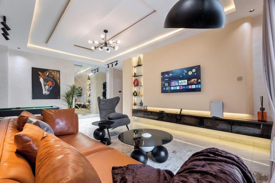 Economy Apartment, Balcony, City View | Living area | Flat-screen TV