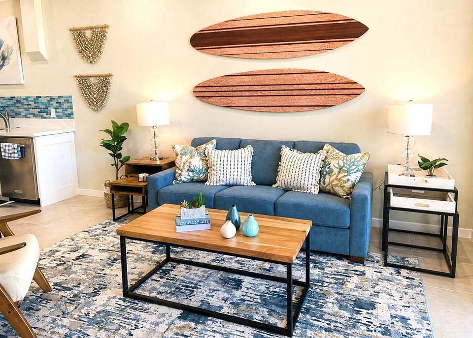 Another view of the living area highlights the coastal artwork and open, relaxed layout NAP-B40