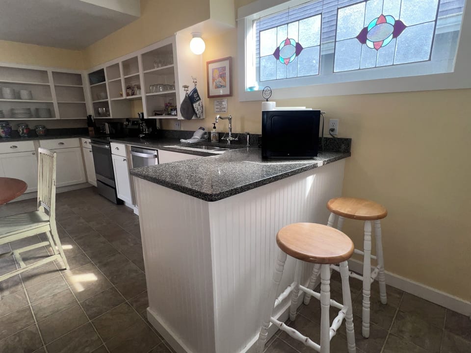 Your fully equipped kitchen features granite countertops and modern appliances, perfect for preparing meals during your stay.