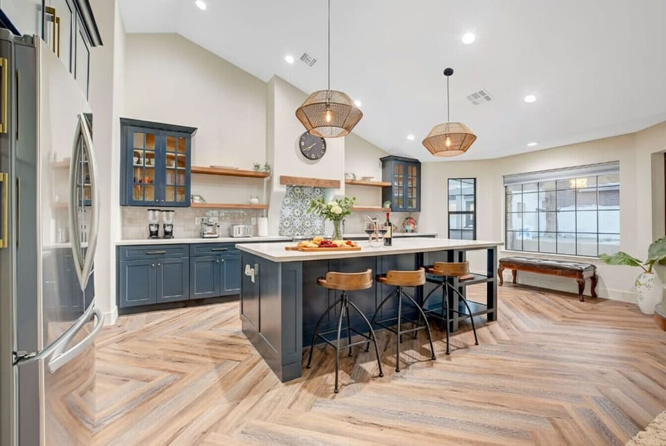 This spectacular, open-concept kitchen combines high-end modern amenities with a warm, welcoming design, making it the perfect spot to gather, cook, and entertain.