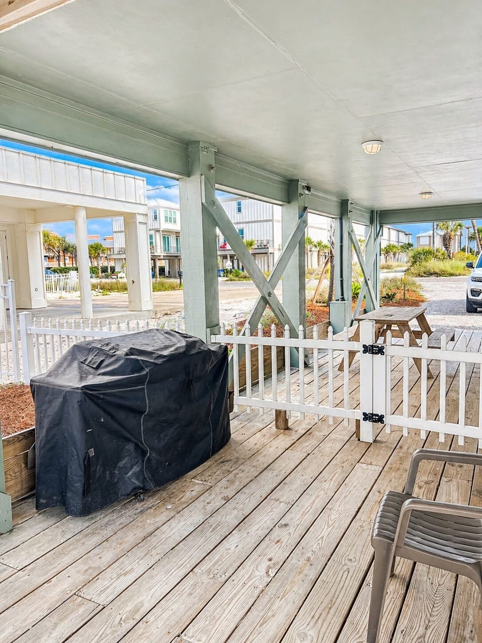 A gas grill is provided along with a picnic table