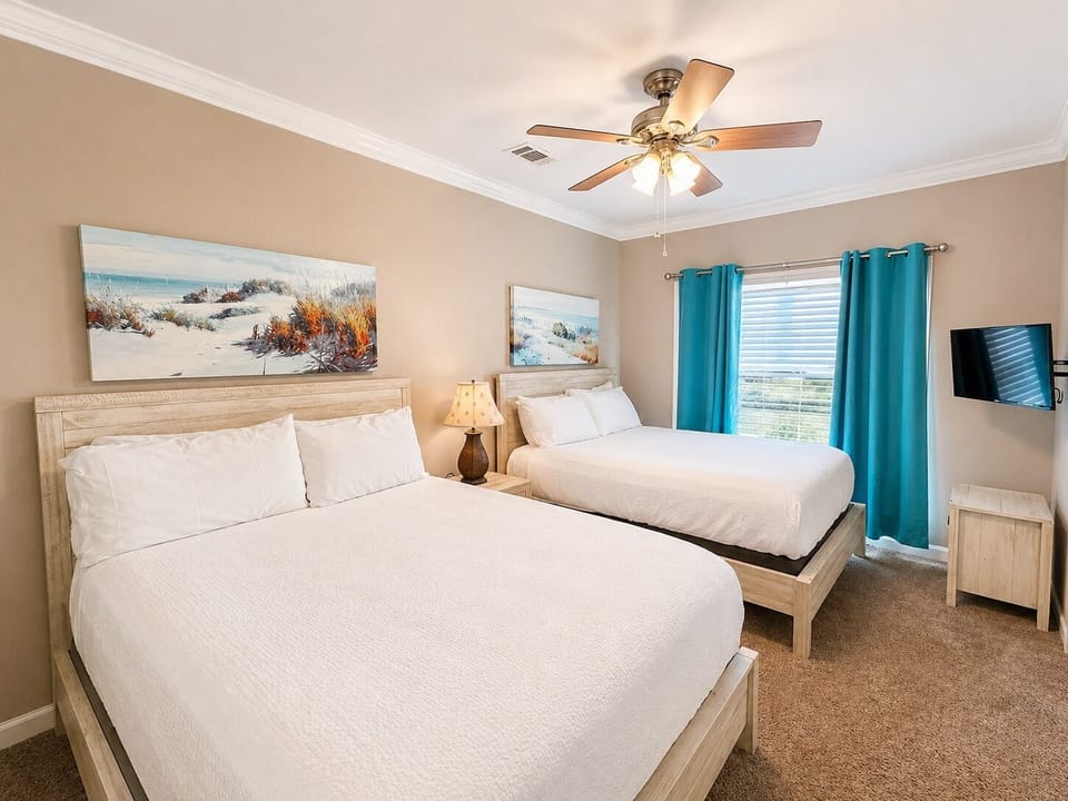 Bedroom 6 has a private bathroom, television and 2 Queen beds - sleeps 4
