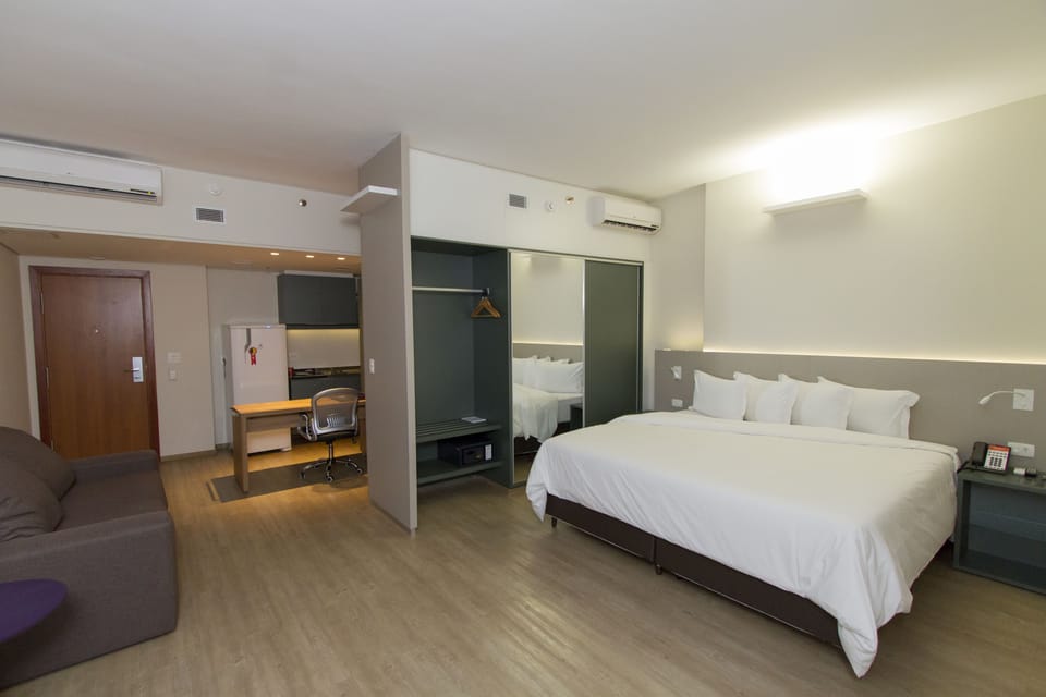 Deluxe Room, 1 King Bed with Sofa bed | Minibar, in-room safe, desk, blackout drapes