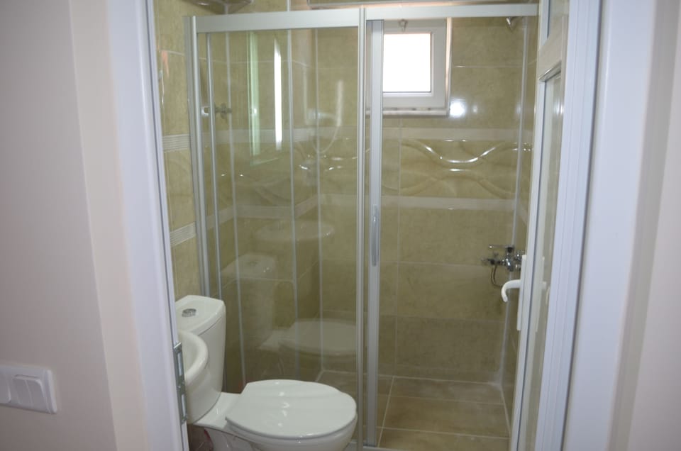 Shower, free toiletries, hair dryer, slippers