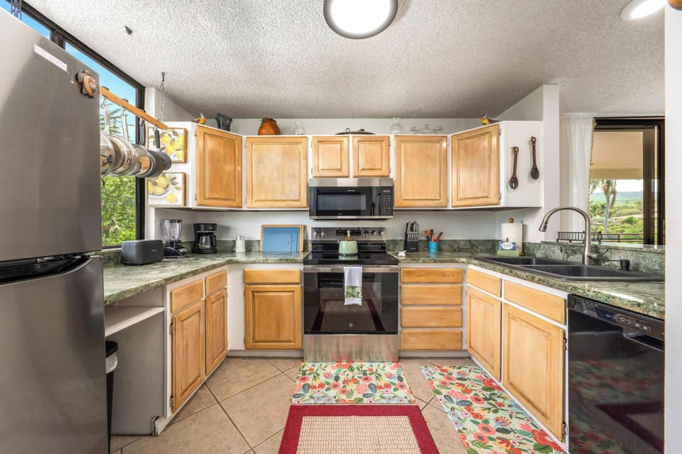 Your fully-equipped kitchen awaits with granite countertops, stainless steel appliances, and everything needed to create memorable meals during your stay.