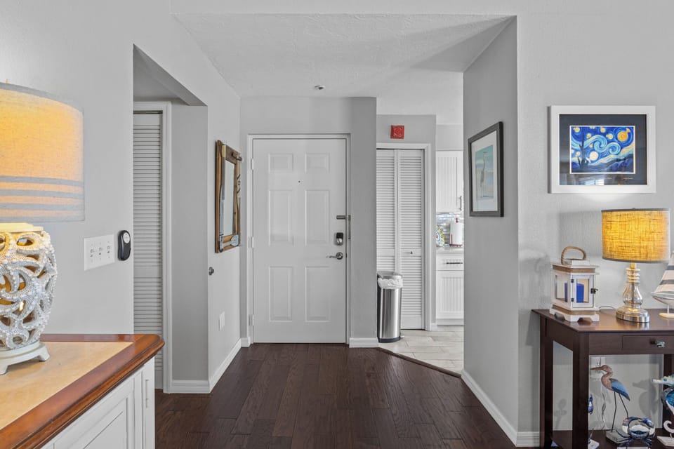 Step into your welcoming entryway with warm lighting and thoughtful decor that immediately makes you feel at home.