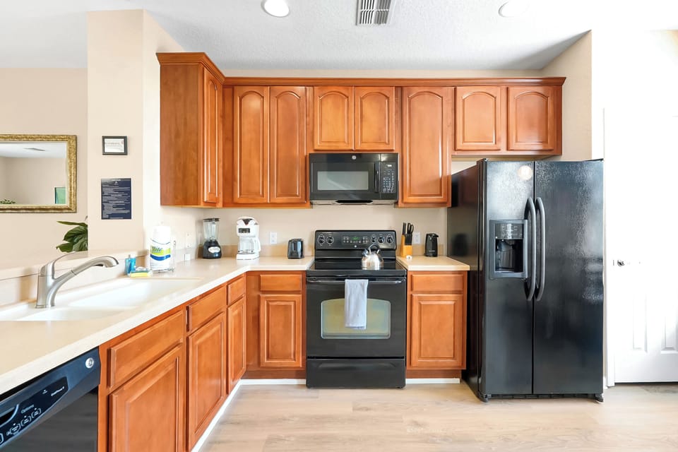 Your fully equipped kitchen features warm wood cabinets, modern appliances, and everything you need to create delicious meals during your stay.