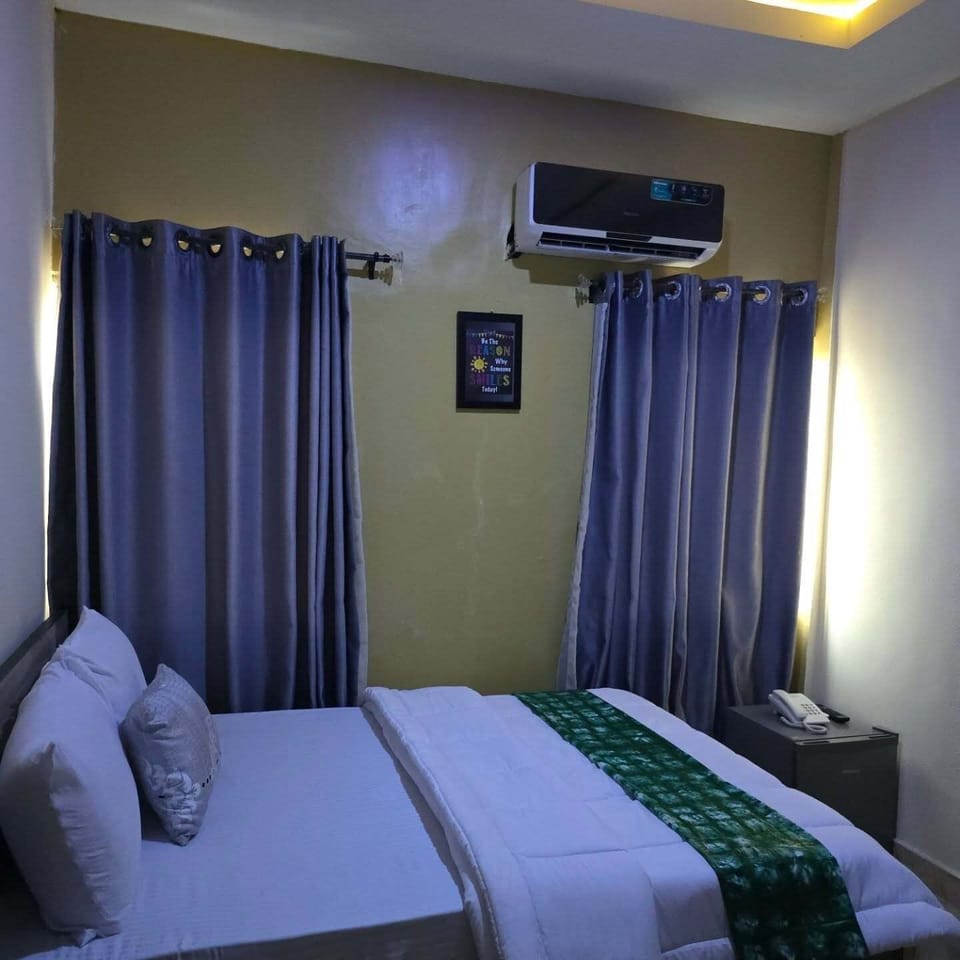 Economy Room, Balcony, City View | Desk, laptop workspace, blackout drapes, soundproofing