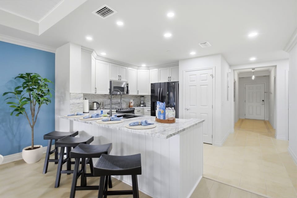 Bright, fully remodeled kitchen with oversized island seating and high-end finishes throughout