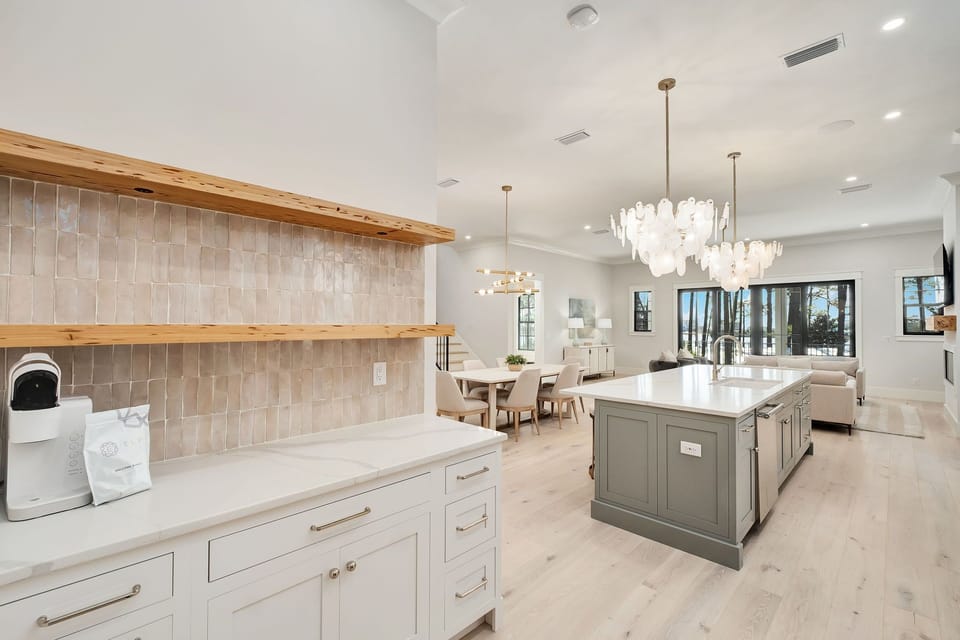 Your gourmet kitchen features stunning open shelving, designer fixtures, and a spacious island perfect for cooking memorable meals together.