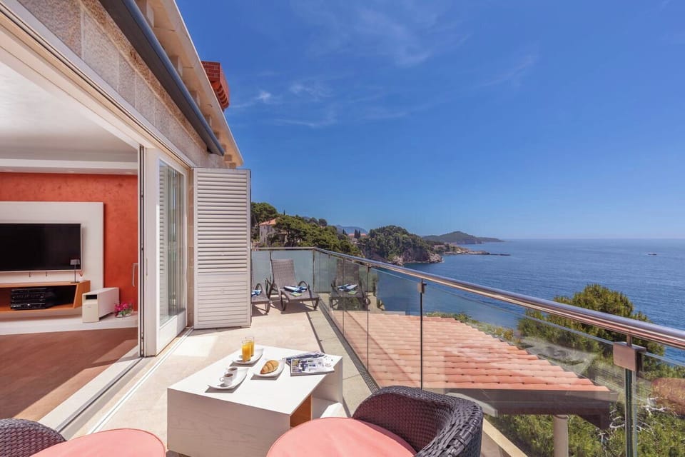 Start your day with breakfast on the private balcony, offering spectacular panoramic views of the Adriatic Sea.