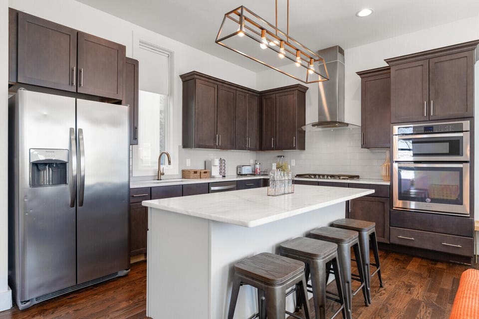 Home 1: Fully loaded with stainless steel appliances, double ovens, a gas range, and all the counter space your group needs to cook up something great.