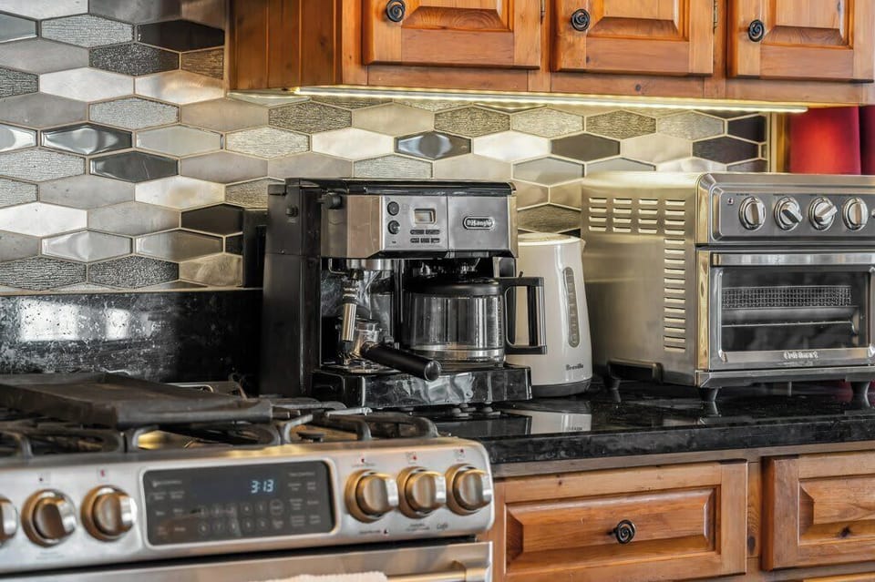 Fully equipped kitchen with gas range and modern appliances