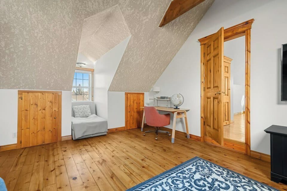 Open loft space with desk and flexible workspace