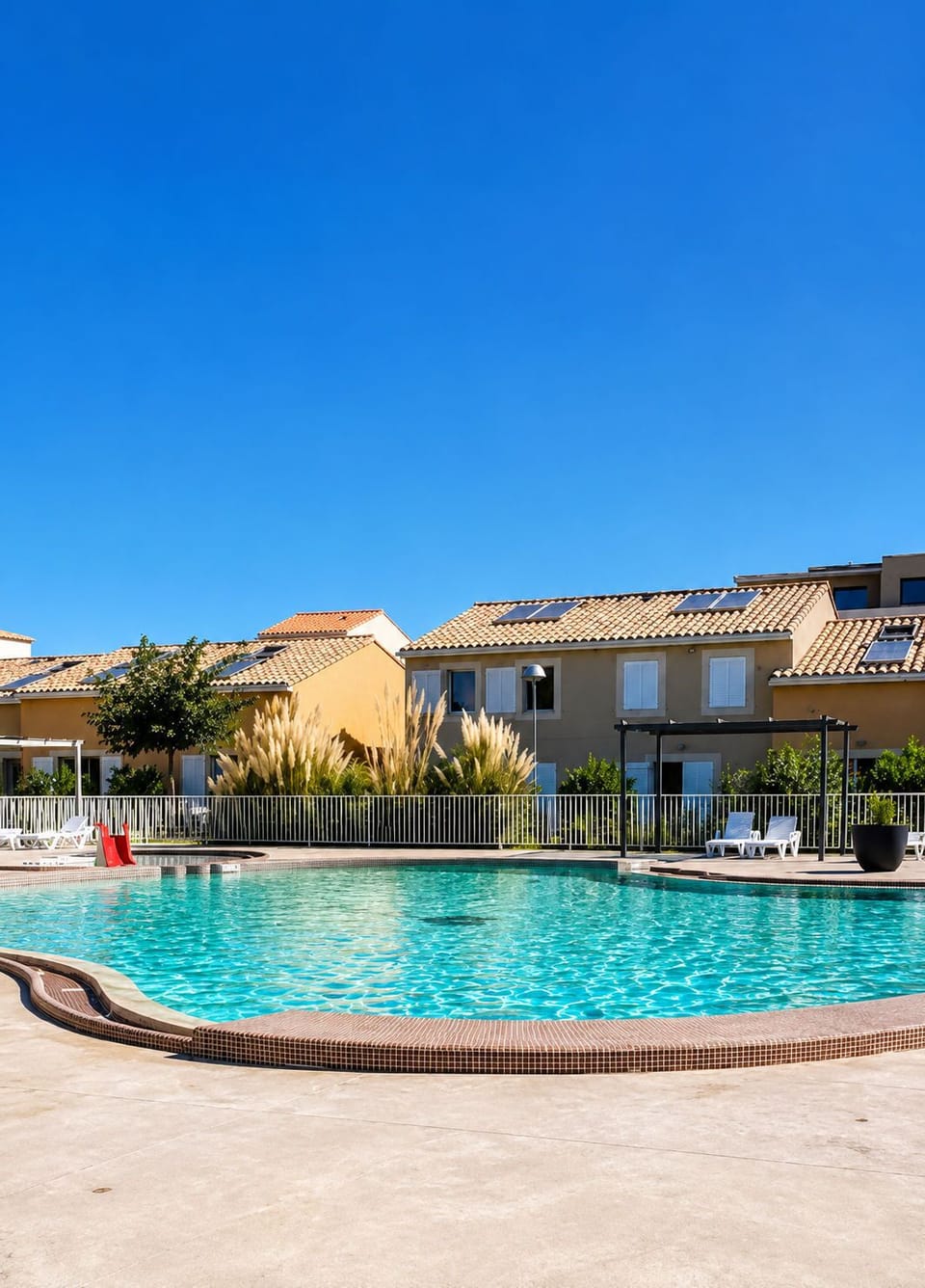 Relax around the pool and enjoy the warmth of the sun.