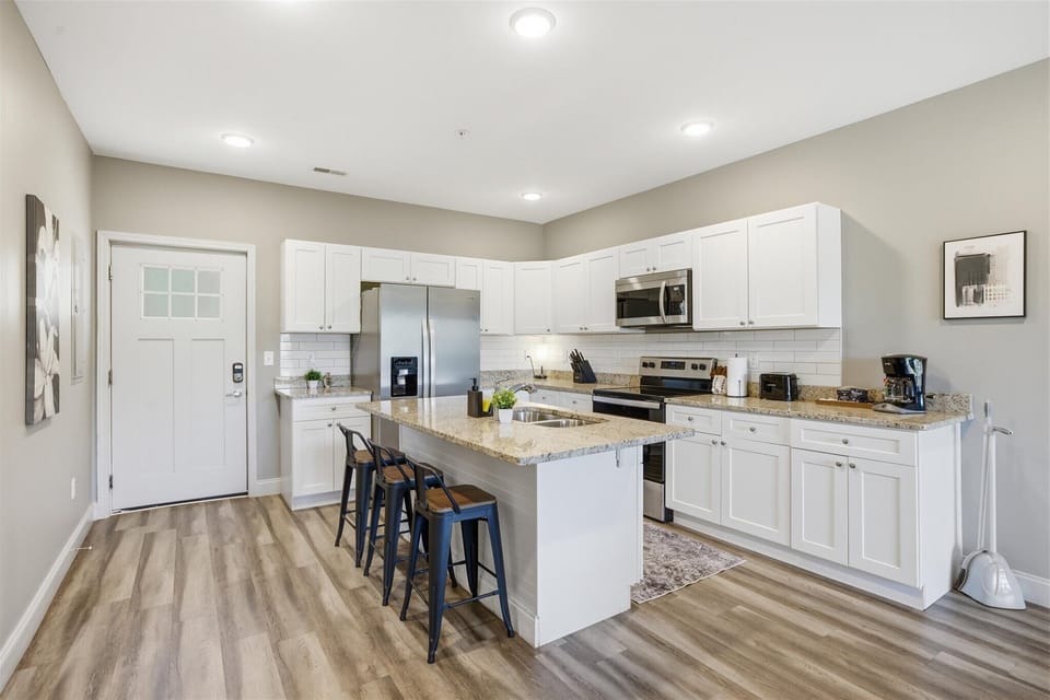 Gather here first—set the snacks out, open the fridge, and make yourself at home. With stainless appliances and plenty of counter space, this kitchen is ready for everything from quick bites to full meals.