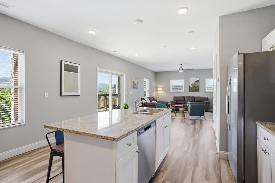 The kind of kitchen that actually works for a group—room to prep here, space to hang out over there, and nobody crowding each other. Spread out, keep the conversation going, and let the day naturally center around this space.
